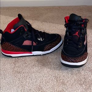 Boys size 3Y red and black Jordan sneakers.